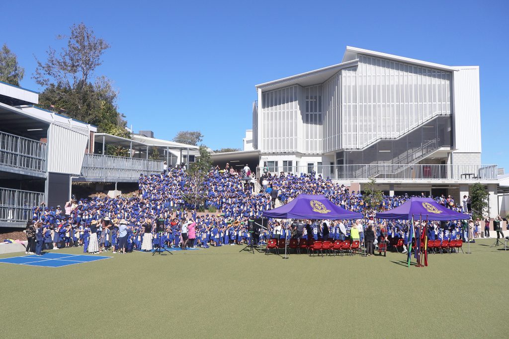 An image of the Indooroopilly State School community celebrating the opening of the new facility.
