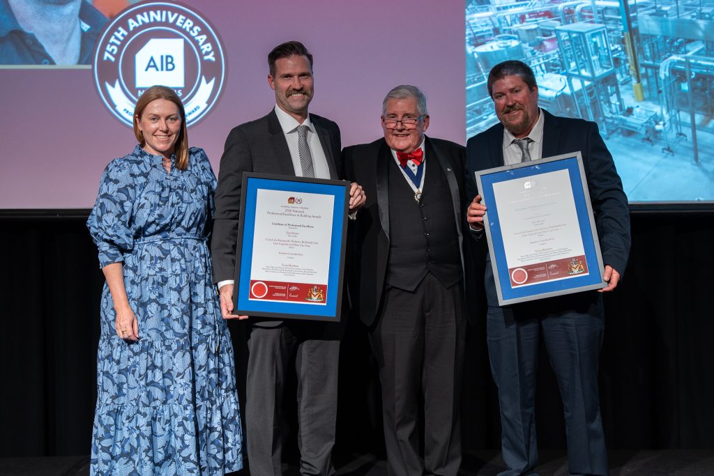 Photo of Wiley MD, Suzie Wiley, and Dan Brown and Coca-Cola team award winner 